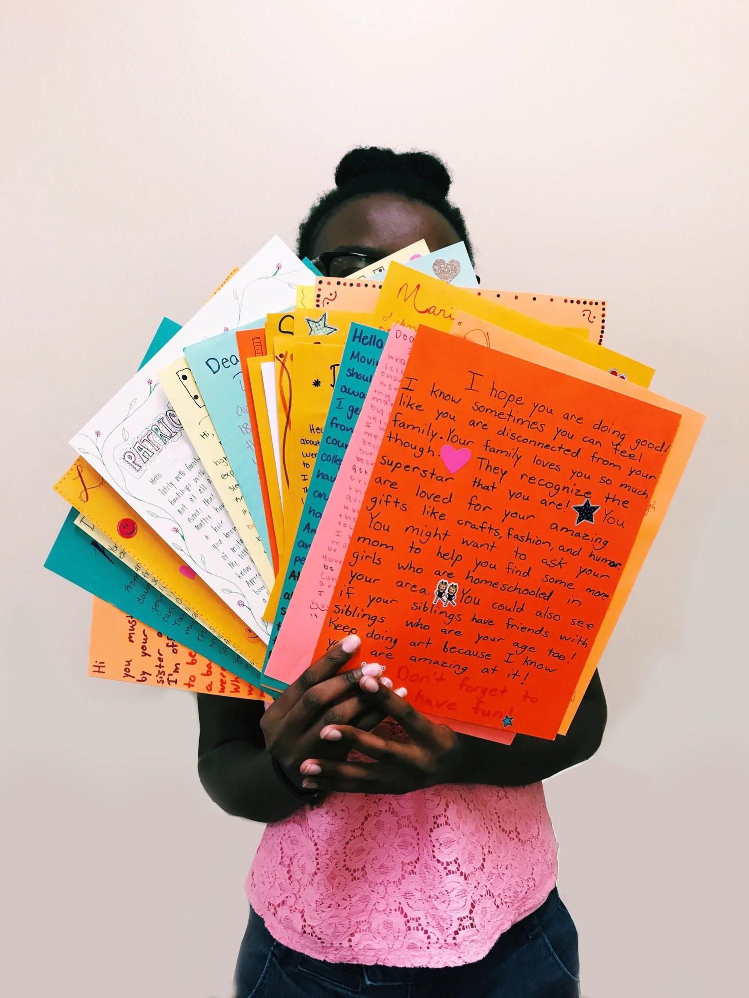 Handwritten notes of encouragement for individuals affected by homelessness