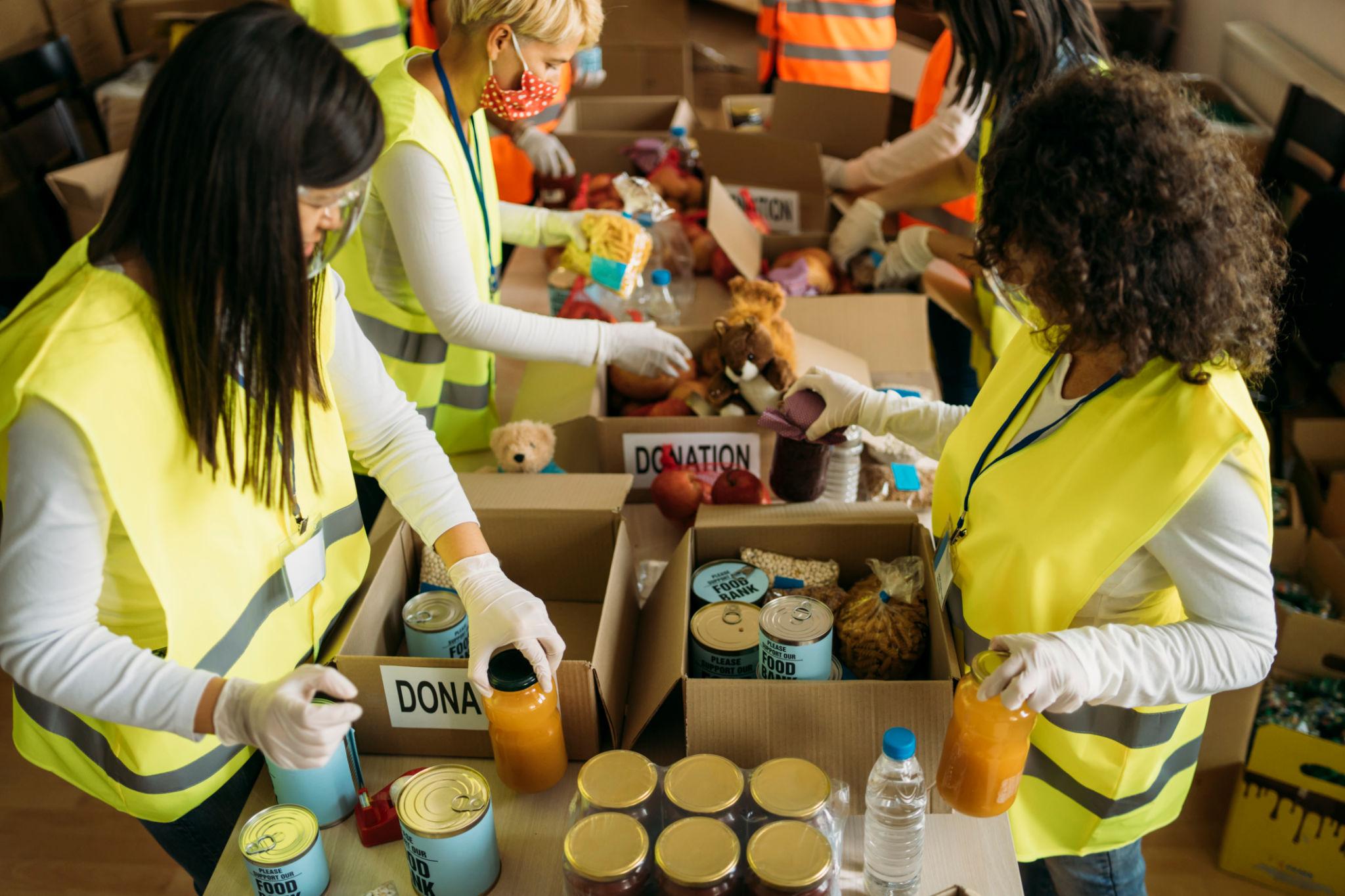Humanitarian aid volunteers organizing relief supplies for Ukraine