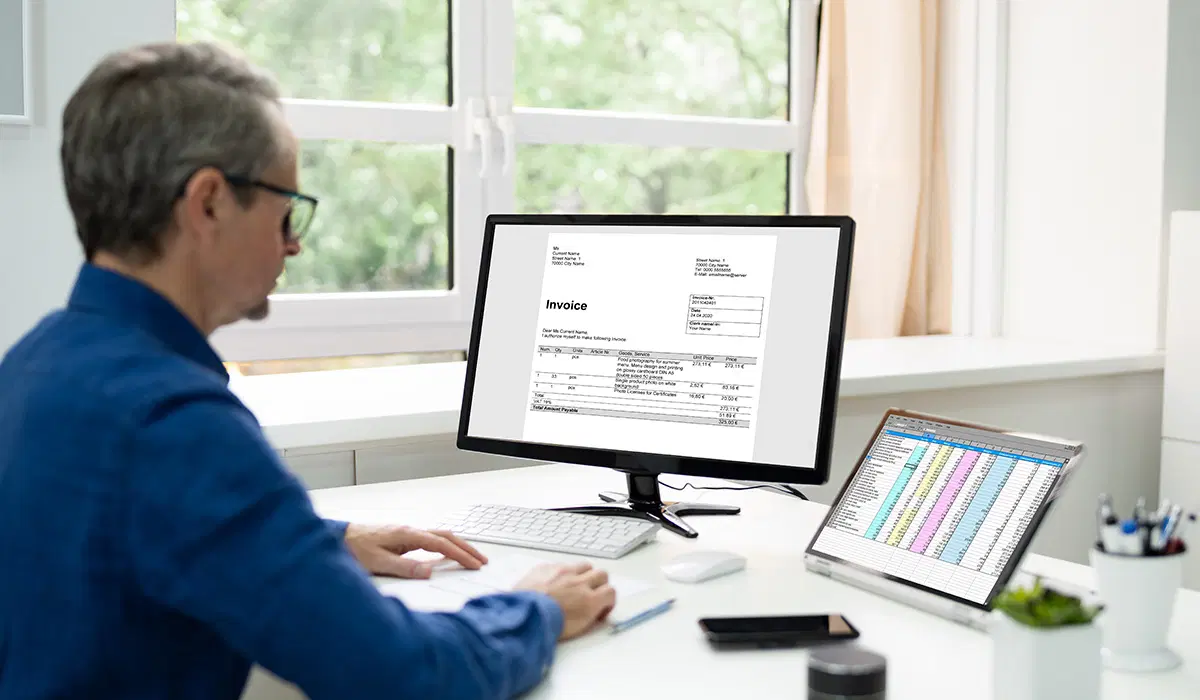 Accountant reviewing financial records — ACA employer reporting and tax compliance