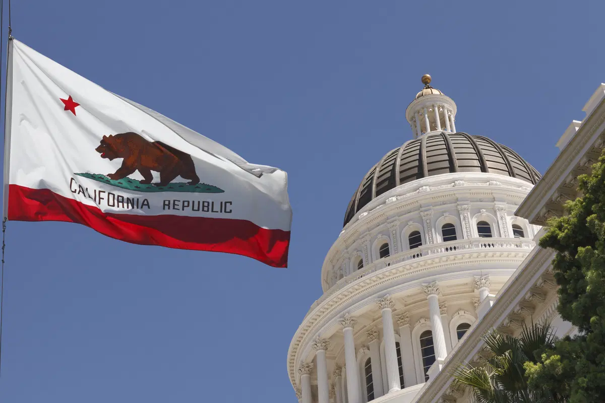 California state capital building — ACA and state insurance mandate compliance context