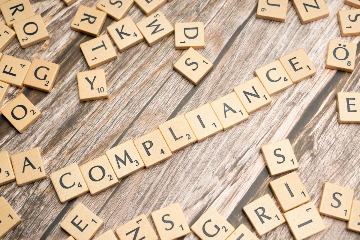 HR professional reviewing employee benefits eligibility verification documents