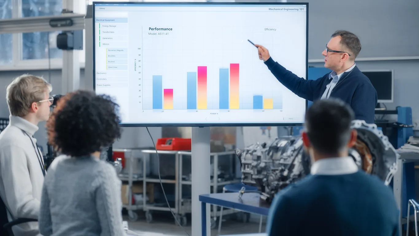 Presenter sharing data with team meeting — benefits enrollment analytics presentation