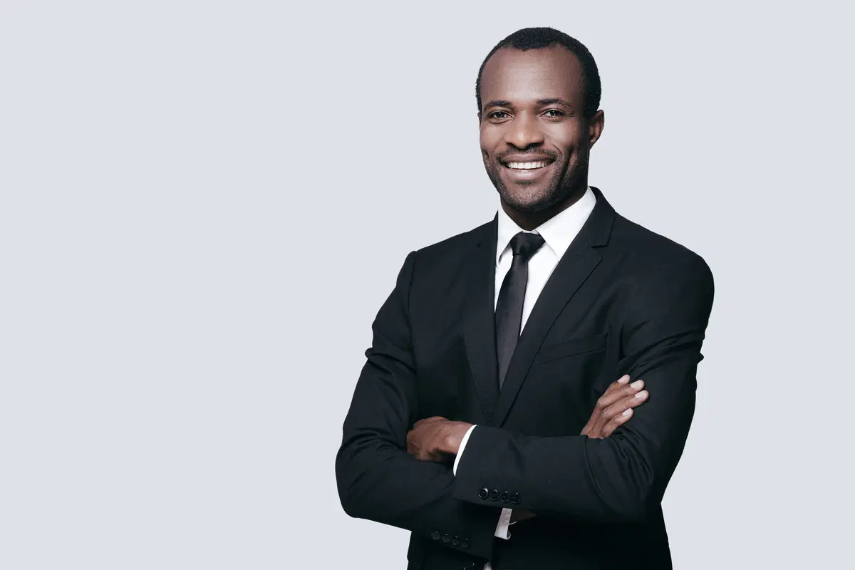Confident HR professional at camera — benefits enrollment consultant