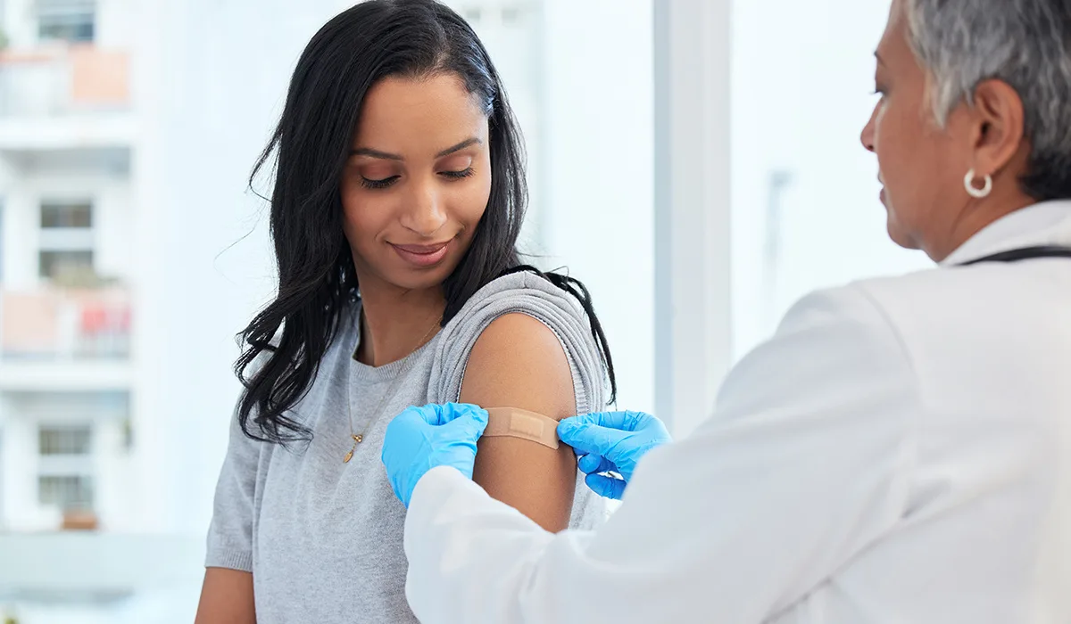 Medical office professional reviewing health insurance documentation — MLR rebate rules and ERISA compliance for employers