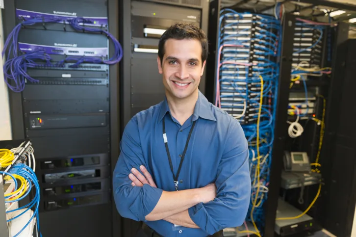 Professional business scene — Security Server Room Smiling — benefits administration context