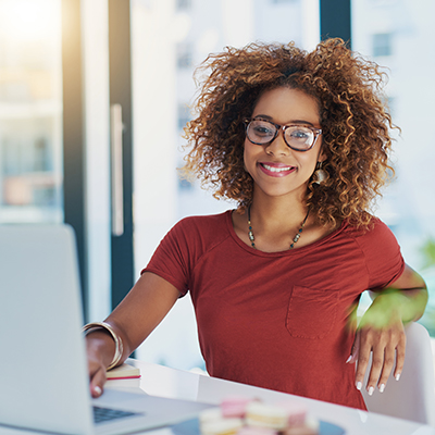 Worker at computer smiling